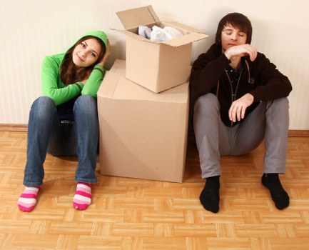 Staff assessing risks before lifting furniture