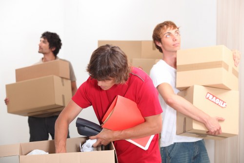 Packed boxes and furniture ready for a same day removal in a Hammersmith flat