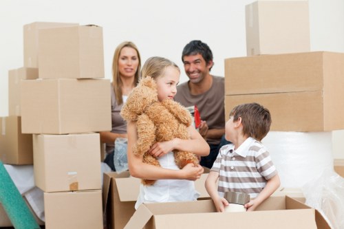 Professional removals team handling furniture loading for a Hammersmith home move